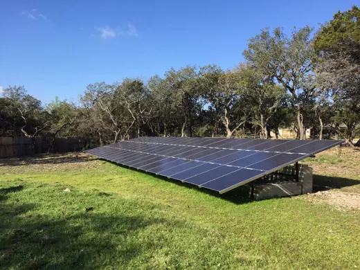 A completed ground-mount solar installation by Advanced Solar, photo 11